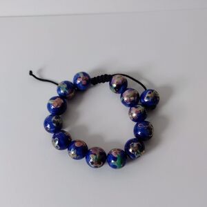 Blue Beaded Bracelet with Floral Design